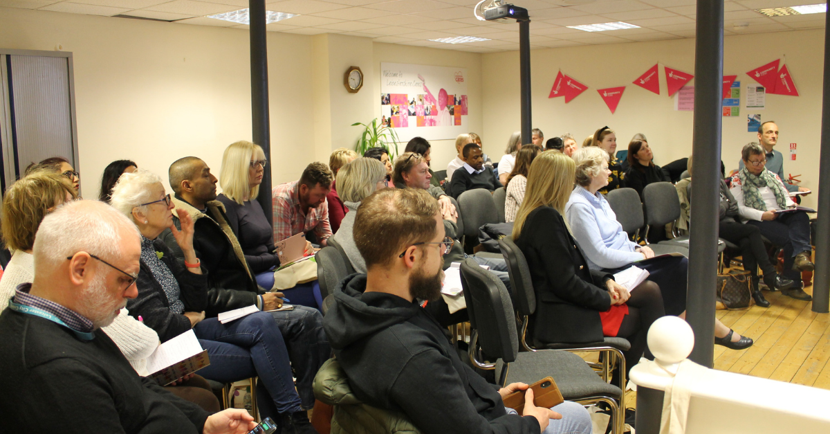 Image of more than 30 representatives of Leicestershire VCSE groups sat at an event organised by the business volunteering charity Leicestershire Cares.