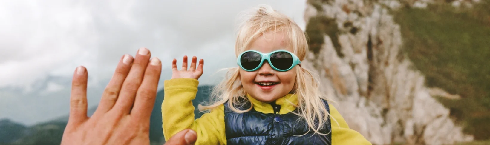 Blonde girl, aged between 3 and 5 wearing sunglasses