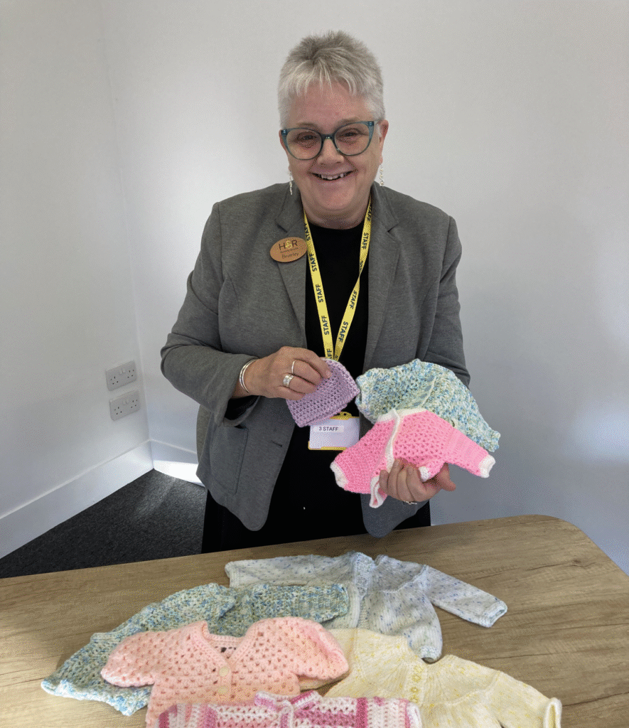 staff member Bev knits cardigans for premature babies
