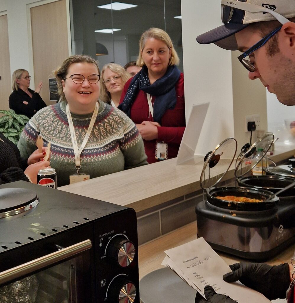 Young people provide a cafe service at lunchtime for Society staff